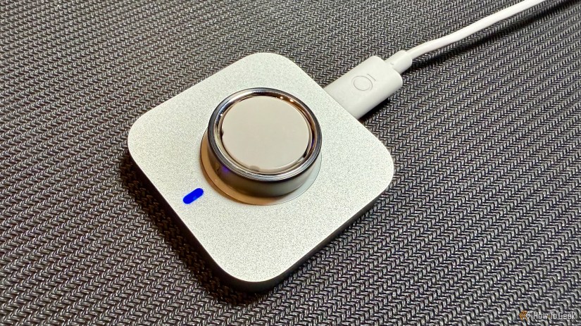 Oura Ring 4 on charger.
