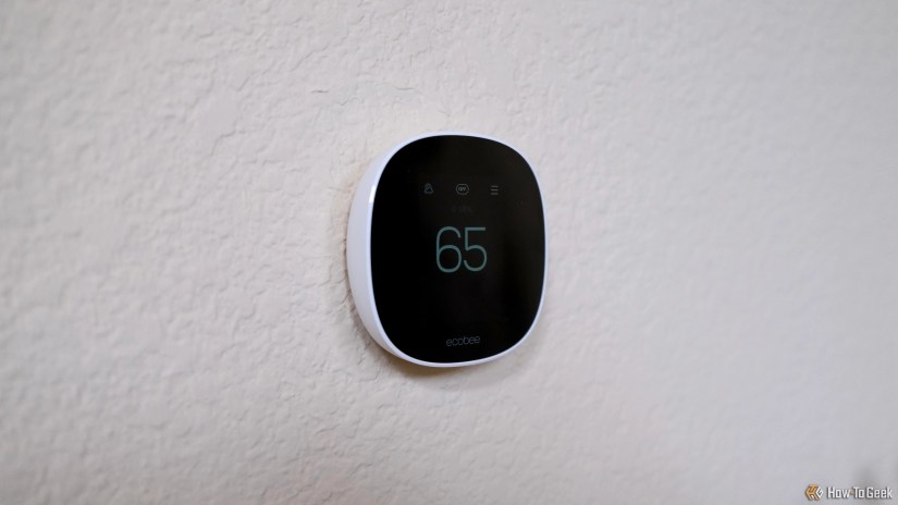Ecobee Smart Thermostat Essential dimmed showing 65 degrees.