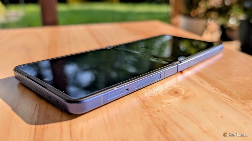 Samsung Galaxy Z Flip 7 folded open flat on a table.