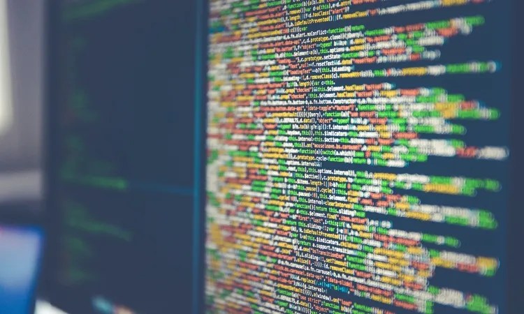 A computer screen filled with colorful lines of code.
