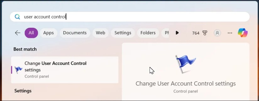 Windows 11 Dekstop with the Start menu search showing user account control