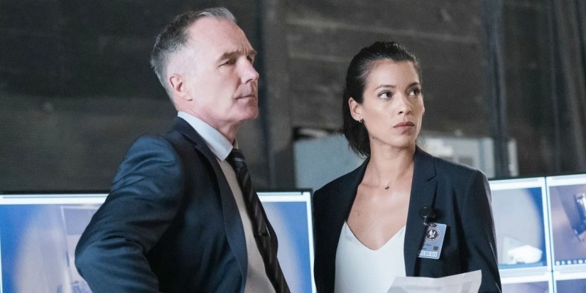 Hick and Cortez looking at something in SWAT