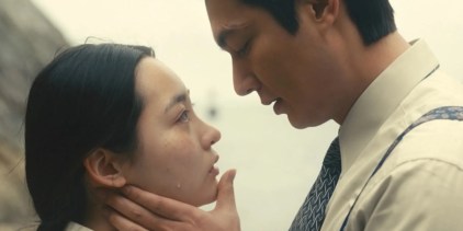 Two characters looking at each other in Pachinko (2022)