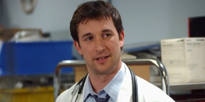 Noah Wyle in ER looking away while wearing medical outfit