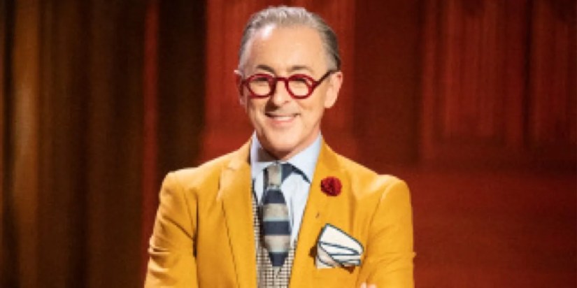 Alan Cumming smiling in The Traitors