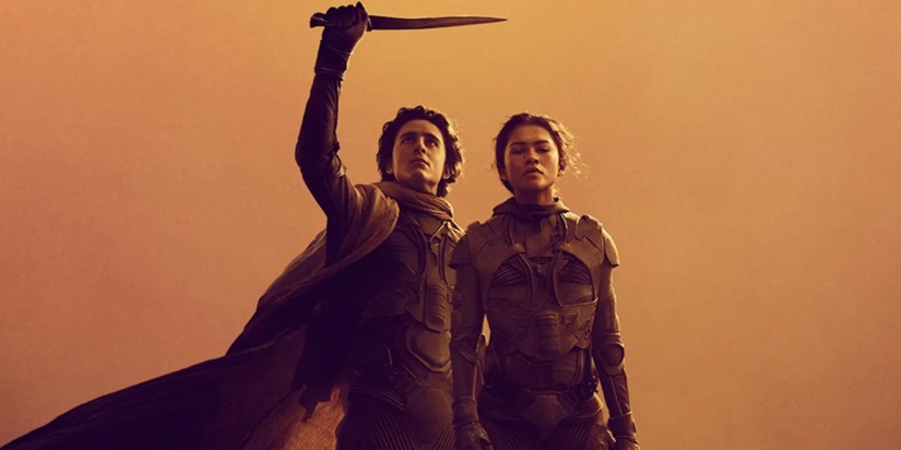 Paul Atreides holds up a knife next toChani on a Dune Part Two poster with a yellow background