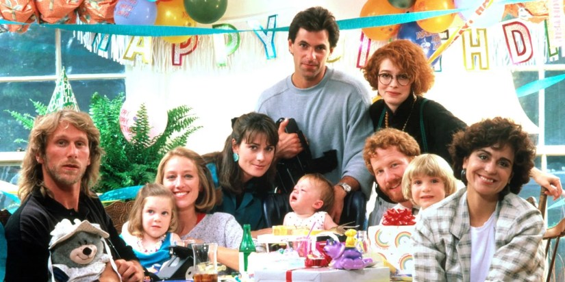 Thirtysomething series cast all smiling at a birthday party.