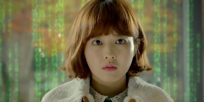 Strong Woman Do Bong soon in front of a string of letters and numbers of computer code