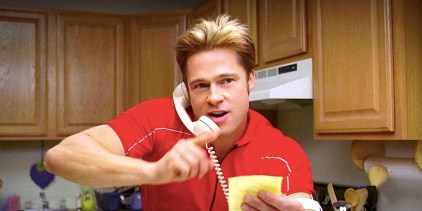 Brad Pitt’s Chad reads from a post it while on the phone in Burn After Reading