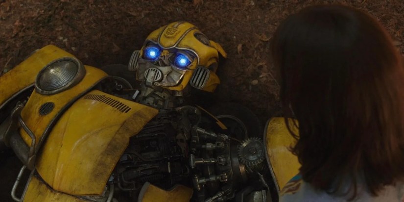 Bumblebee lying on the ground next to Hailee Steinfeld.