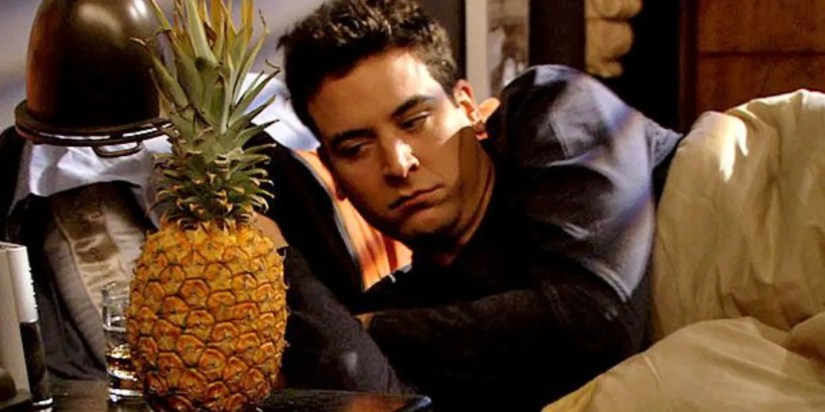 Josh Radnor as Ted Mosby waking up and looking confused at the pineapple next to him in the How I Met Your Mother episode “The Pineapple Incident."