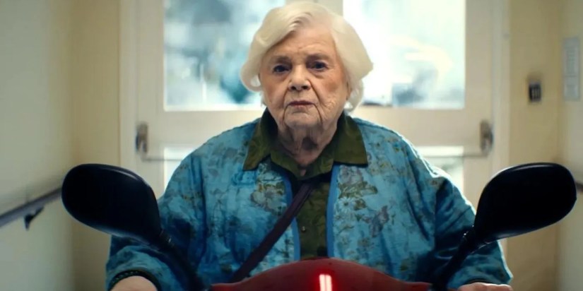 June Squibb as Thelma looking determined on a motorized scooter in Thelma