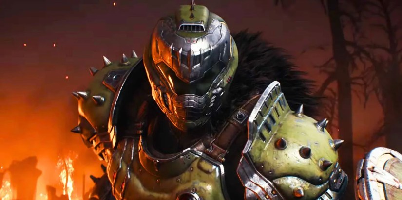 The Doom Slayer In DOOM: The Dark Ages staring at the camera with flames behind him.