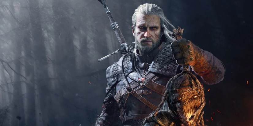 Geralt holding up the trophy of a monster’s head