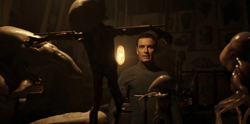 The android David (Michael Fassbender) admires one of his biological experiments