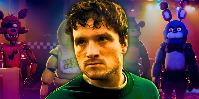 Josh Hutcherson as Mike looking distraught in the FNAF movie with the classic Five Nights at Freddy’s animatronics looming behind him