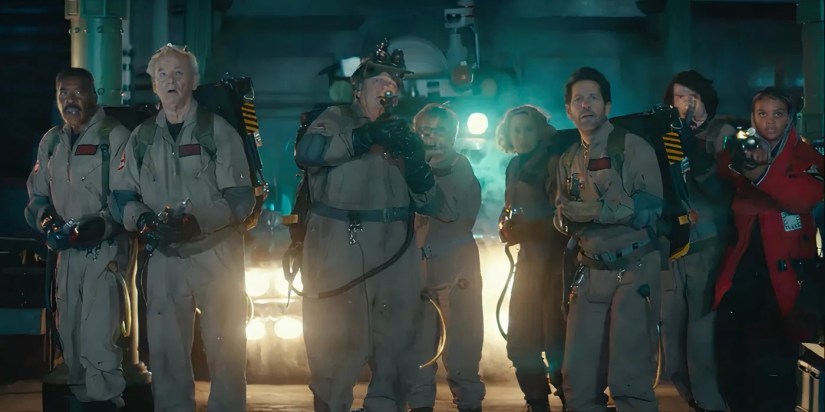 The old and new Ghostbusters walk with their proton packs in Ghostbusters Frozen Empire