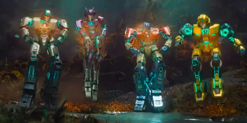 Megatron, Elita-One, Orion Pax, and Bumblebee with their new reactors in their chests filled with superpowe in Transformers One