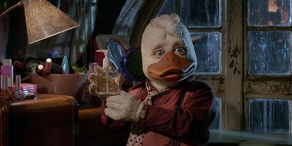 Howard holding a bottle of hand soap in Howard The Duck.