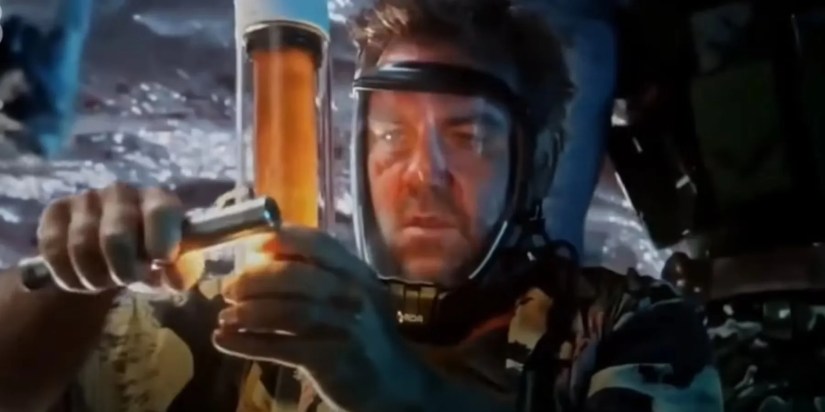 A scientist with Amrita in Avatar The Way of Water