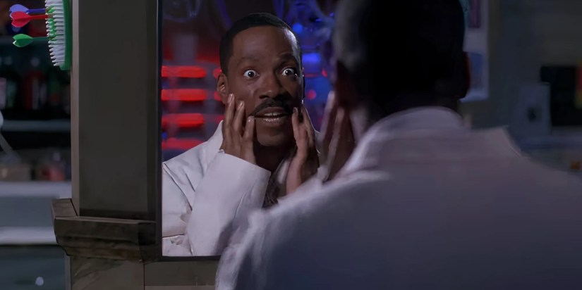 Eddie Murphy as Sherman Klump looking shocked at his weight loss in The Nutty Professor.