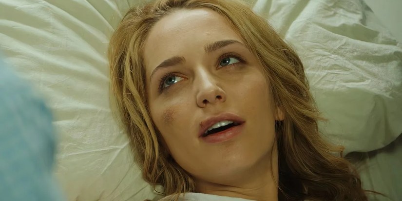 Jessica Rothe as Tree Gelbman in a hospital bed in the alternate ending of Happy Death Day.