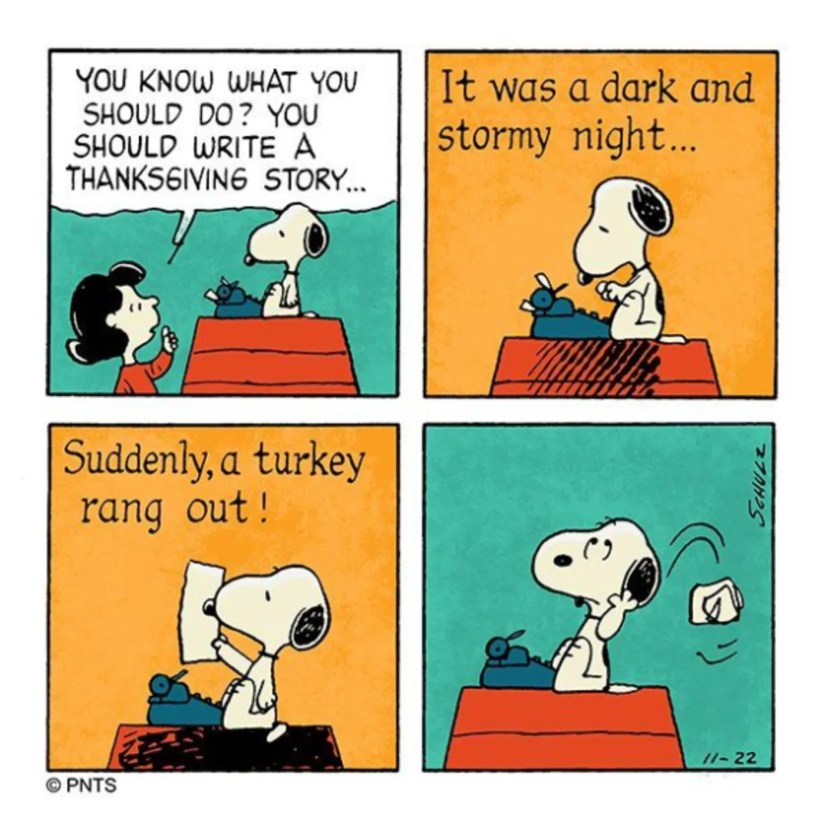 Snoopy writing on his typewriter.