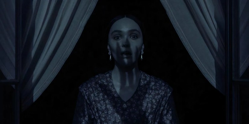 Nosferatu image of woman standing at window