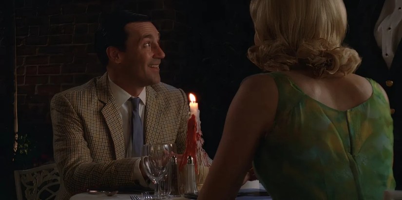 Jon Hamm as Don Draper talking to Bethany Van Nuys over dinner in the Mad Men episode &ldquo;The Summer Man.&quot;