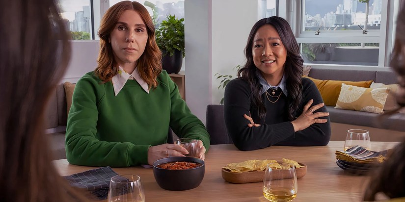 Zosia Mamet’s AJ looking intently and Stephanie Hsu’s Ruby smiling while talking to someone in Laid
