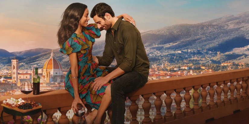 Zoe Saldana and Eugenio Mastrandrea cuddling on a balcony in Netflix&rsquo;s From Scratch