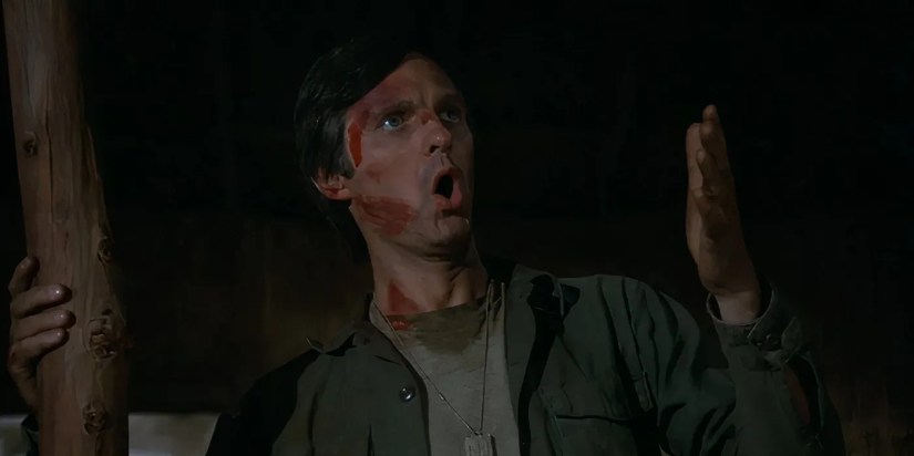 Alan Alda as Hawkeye ranting and covered in blood in the MASH episode “Hawkeye."