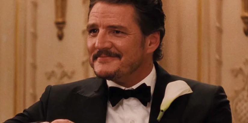 Pedro Pascal smiling slightly while wearing a tux in Materialists