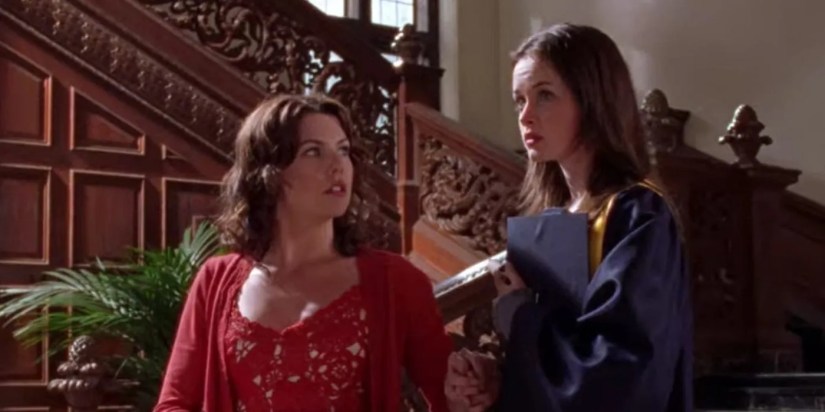 Lorelai leading Rory down the stairs as they start heading to graduation in the Gilmore Girls season 3 episode &ldquo;Those Are Strings, Pinocchio.&quot;