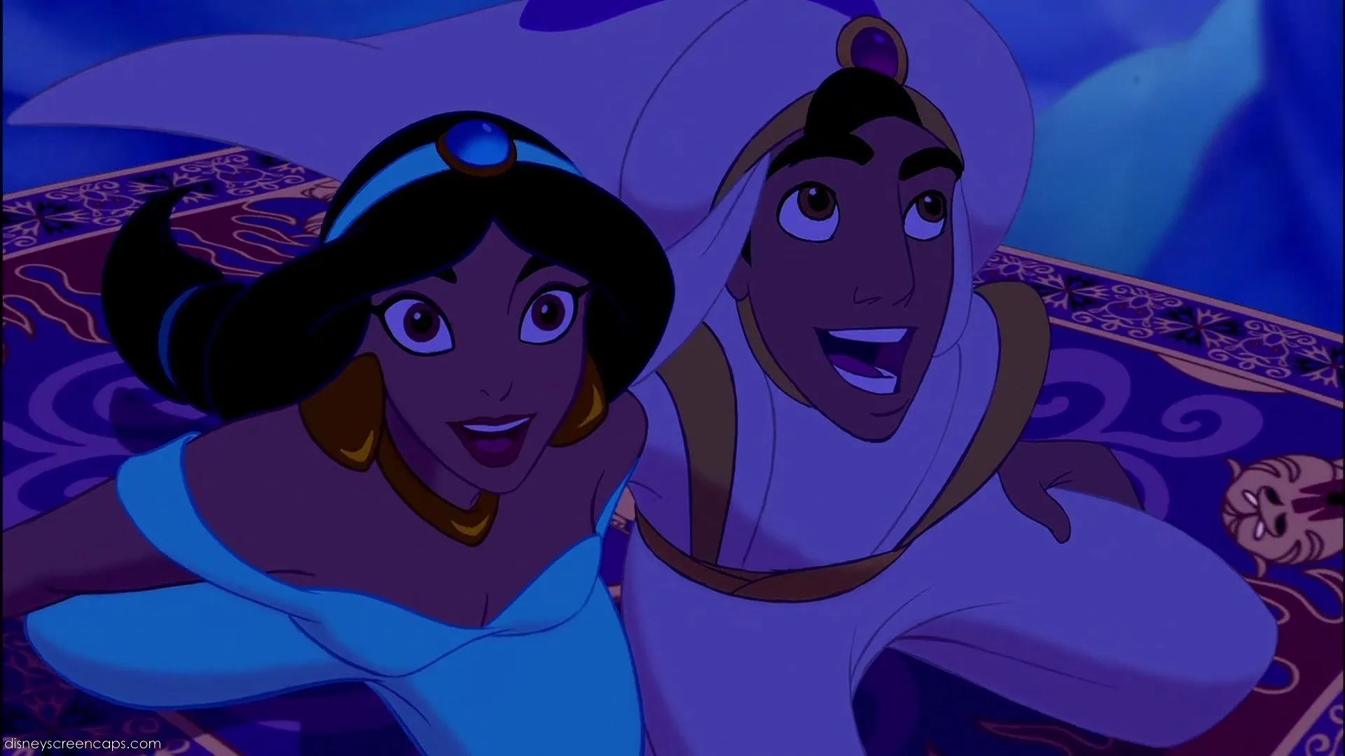 A still frame from Disney&rsquo;s Aladdin, showing Jasmine and Aladdin looking awed while riding a magic carpet.