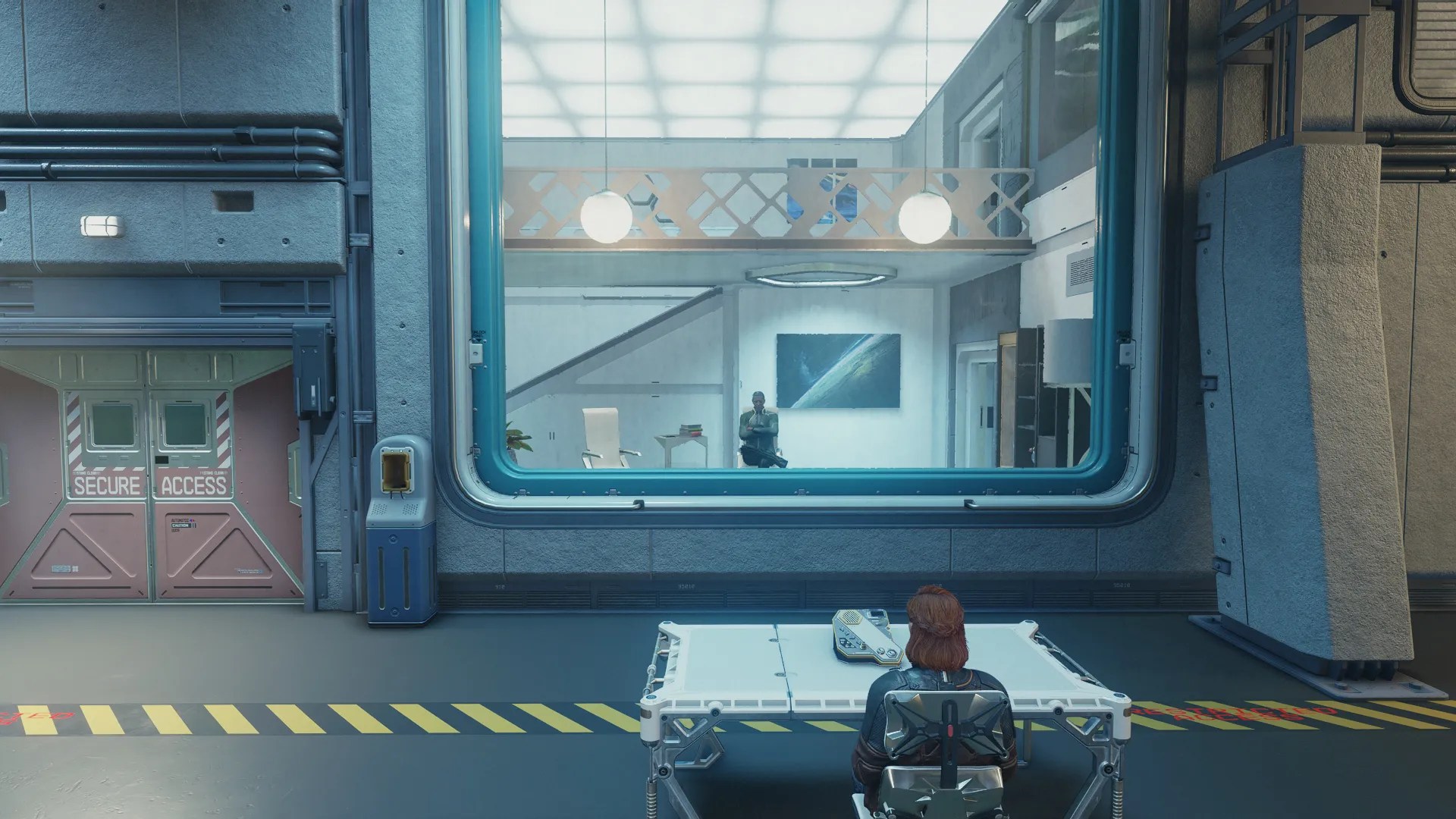 Sitting to use the intercom in Subsection Seven in Starfield