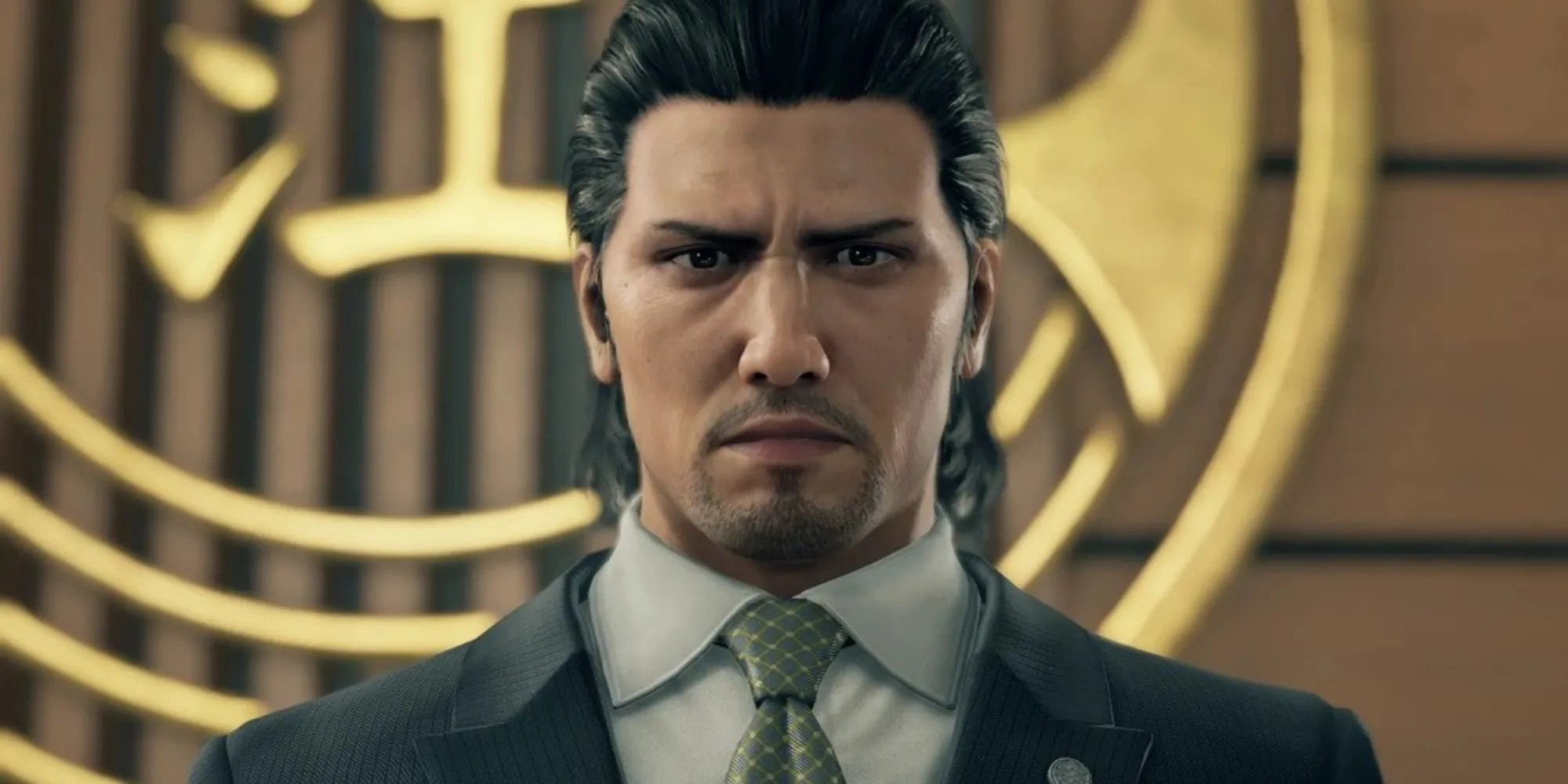 Daigo Dojima standing in front of the Tojo crest while looking at the camera with a serious expression.