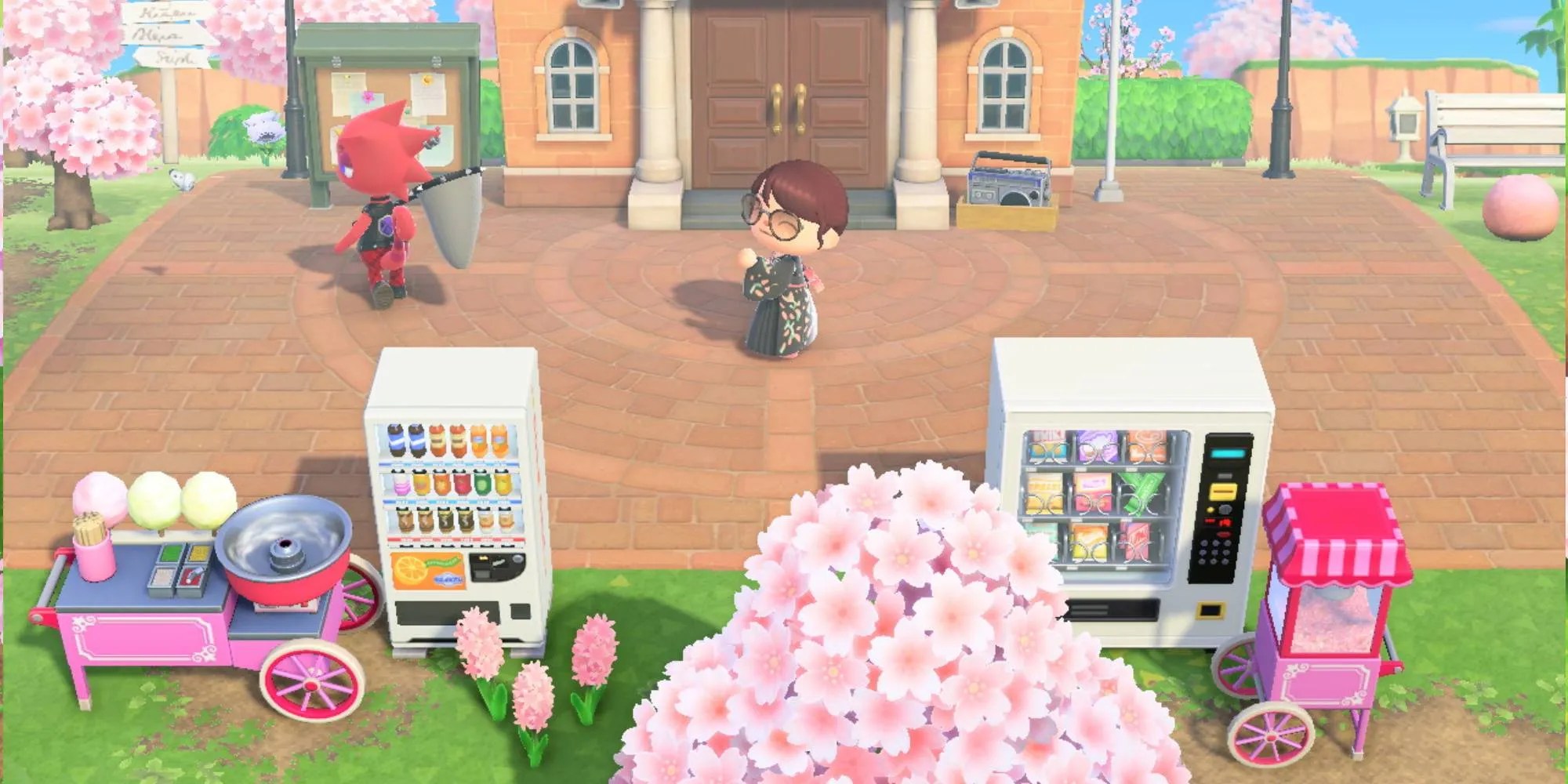 A villager dancing in front of resident services with vending machines, a popcorn, and cotton candy maker in Animal Crossing: New Horizons.