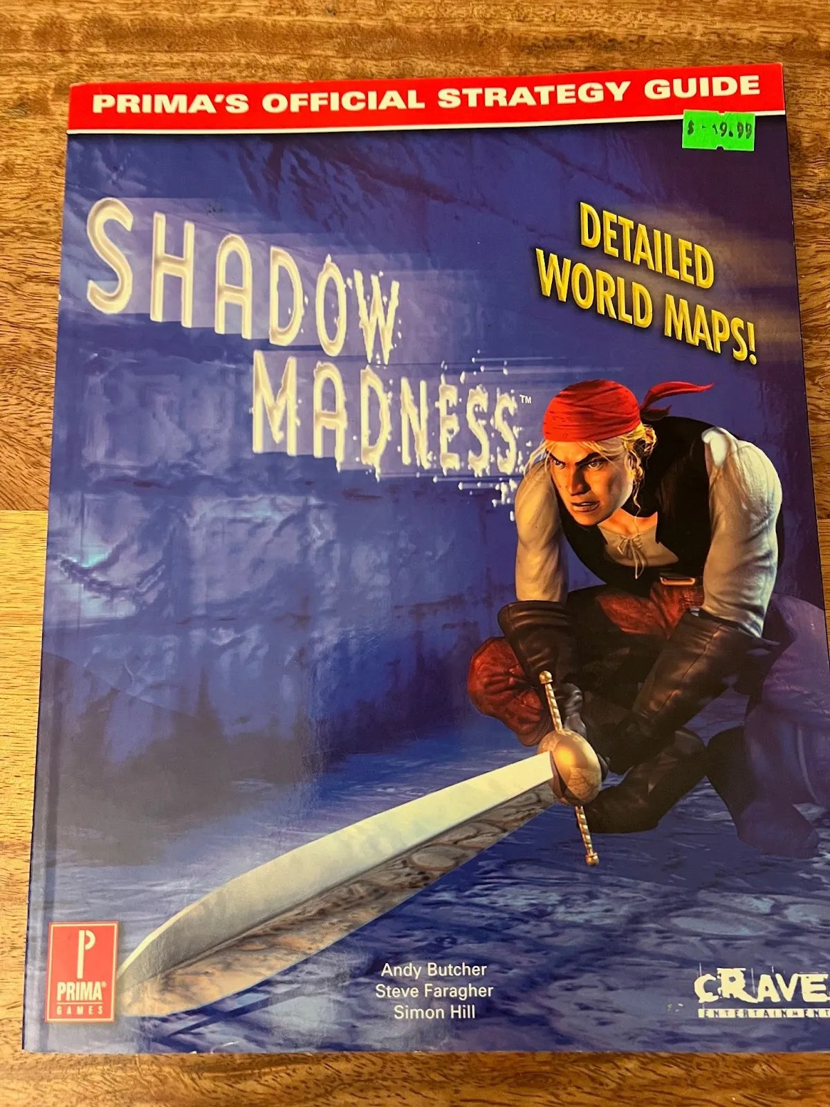 An old game guide for the game Shadow Madness. The cover features a man with a sword.