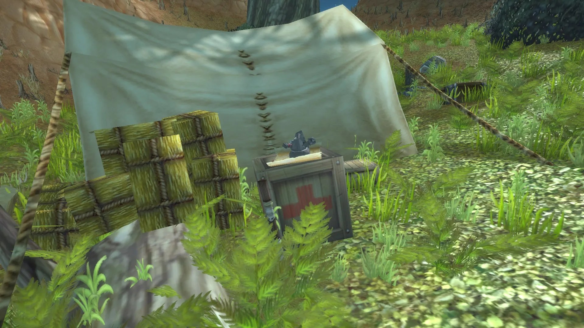 A tent with supplies in front of it among some grass in the Stonetalon Mountains