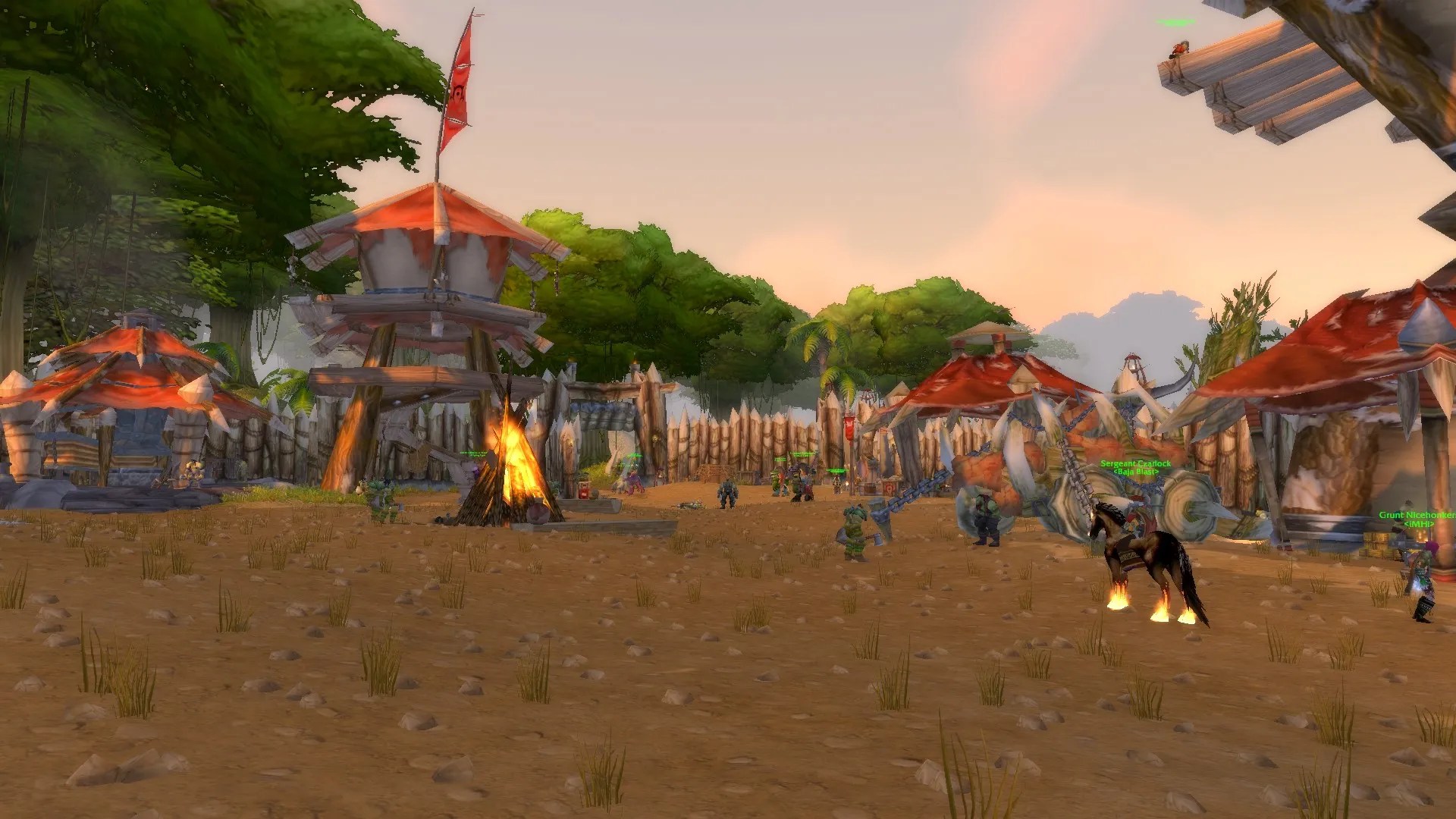 The Horde town of Grom’Gol Base Camp, with orcish architecture inhabited by various citizens of the Horde