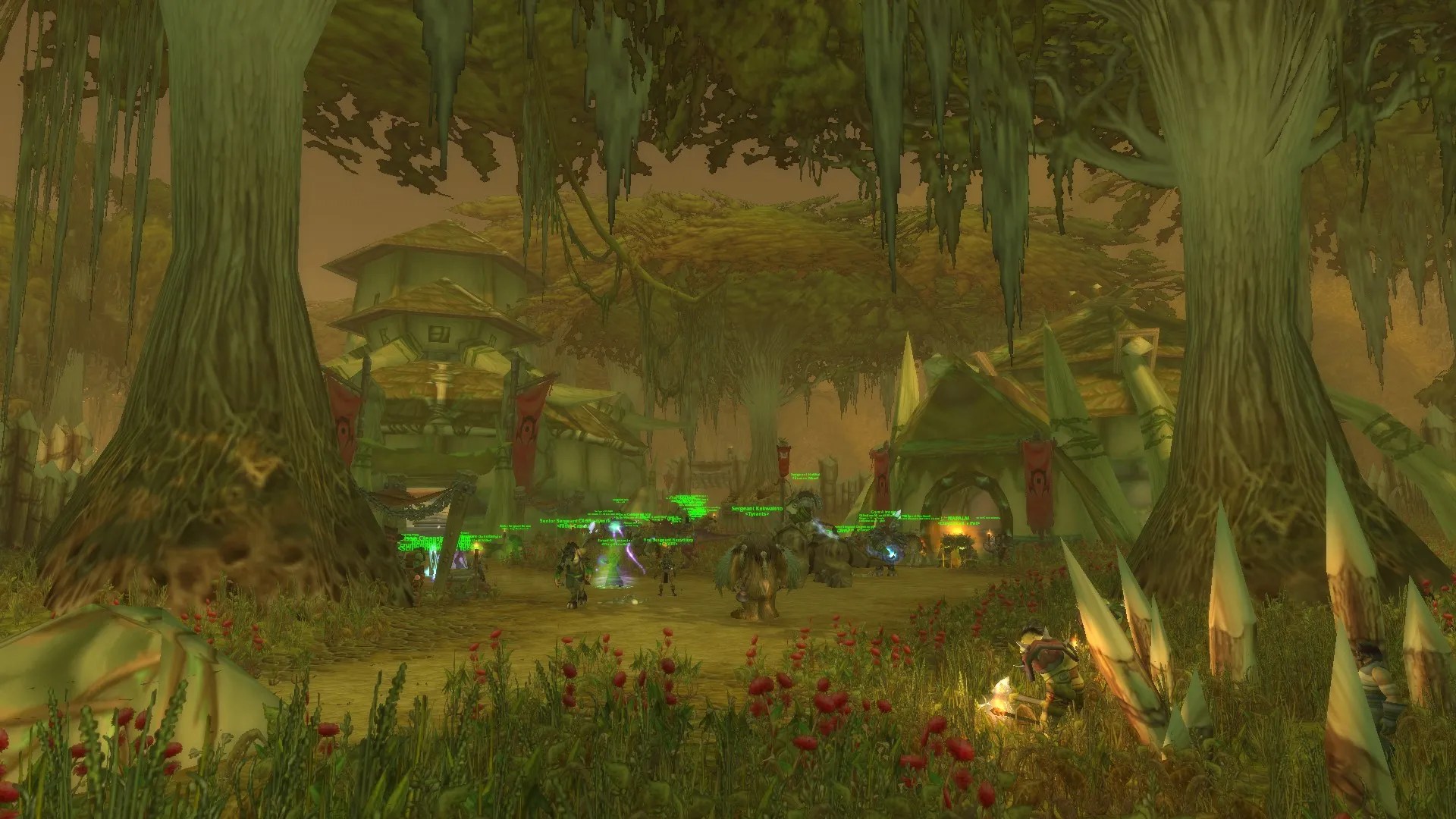 The orcish town of Stonard, with trees, buildings, and Horde adventurers milling about