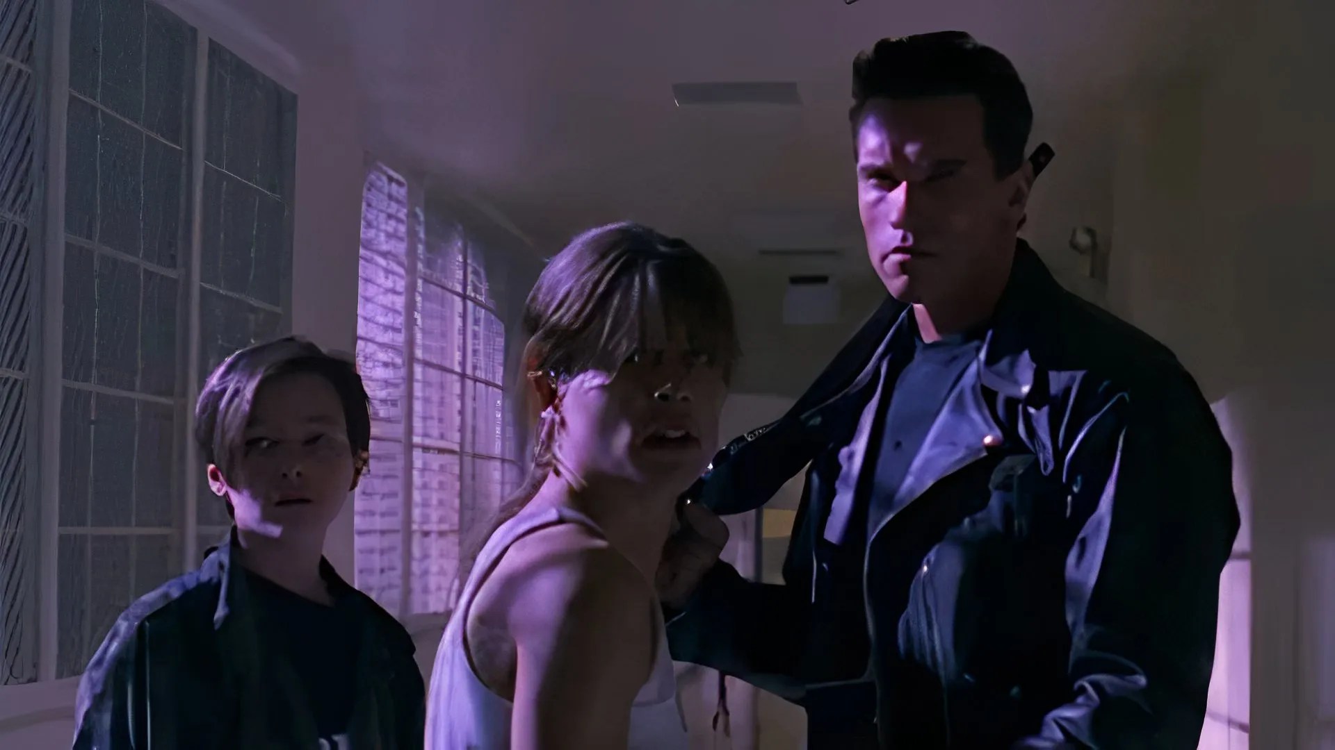 John Connor, Sarah Connor, and the terminator in Terminator 2: Judgment Day.
