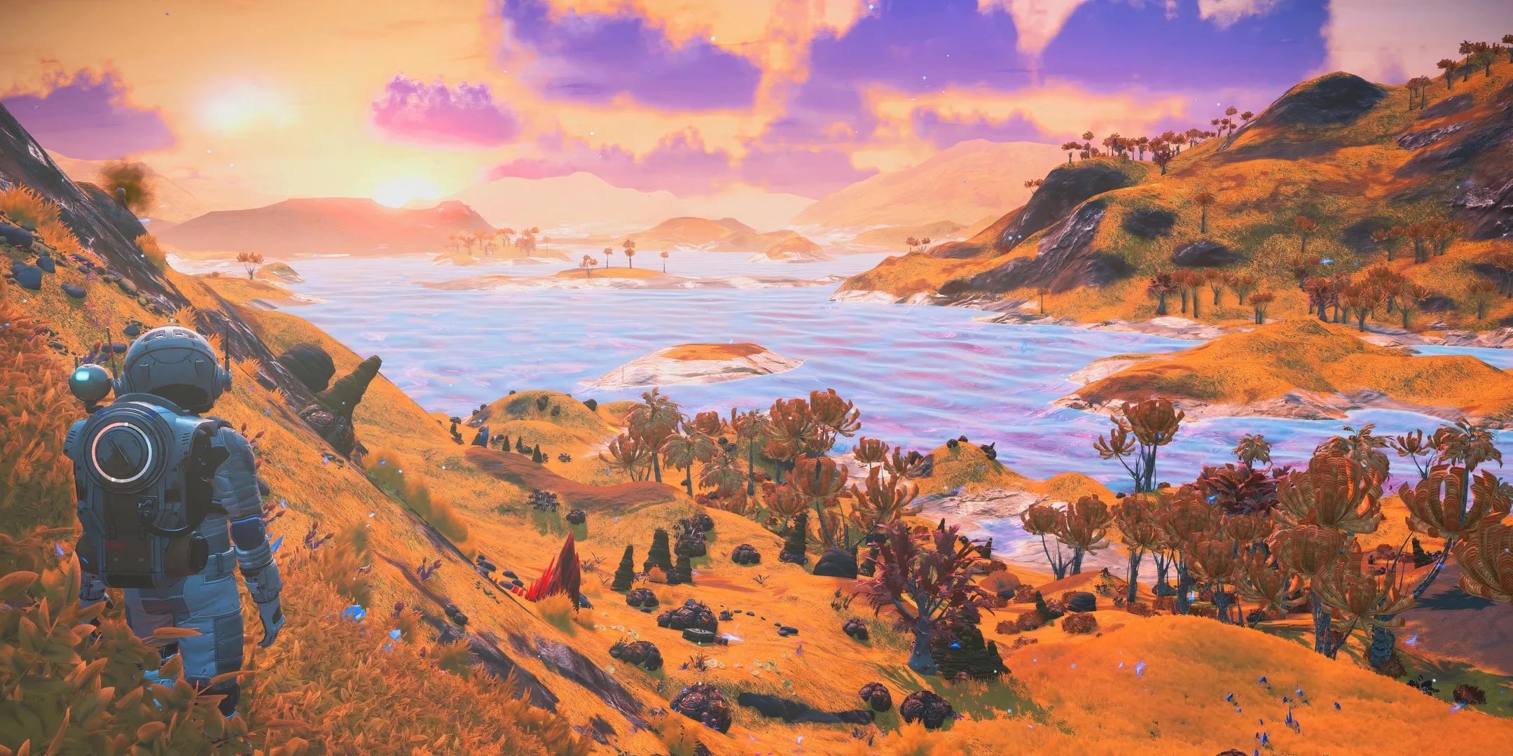 Player is overlooking the planet&rsquo;s cloudy sunset in No Man&rsquo;s Sky