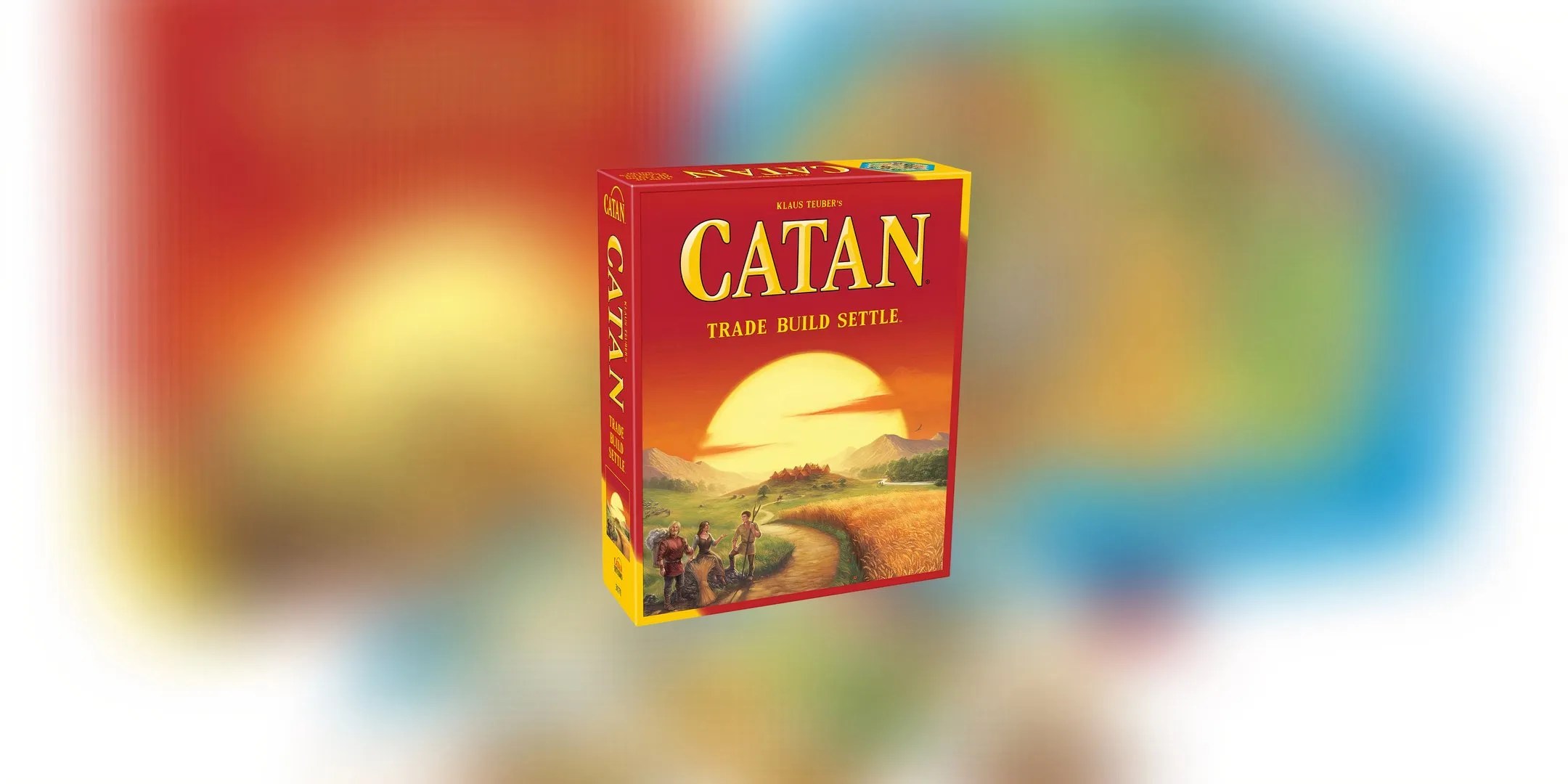 The cover art on the box of Catan depicts a sunset that turns into the red of the box. Against an open field is a group of settlers are in the bottom left hand corner