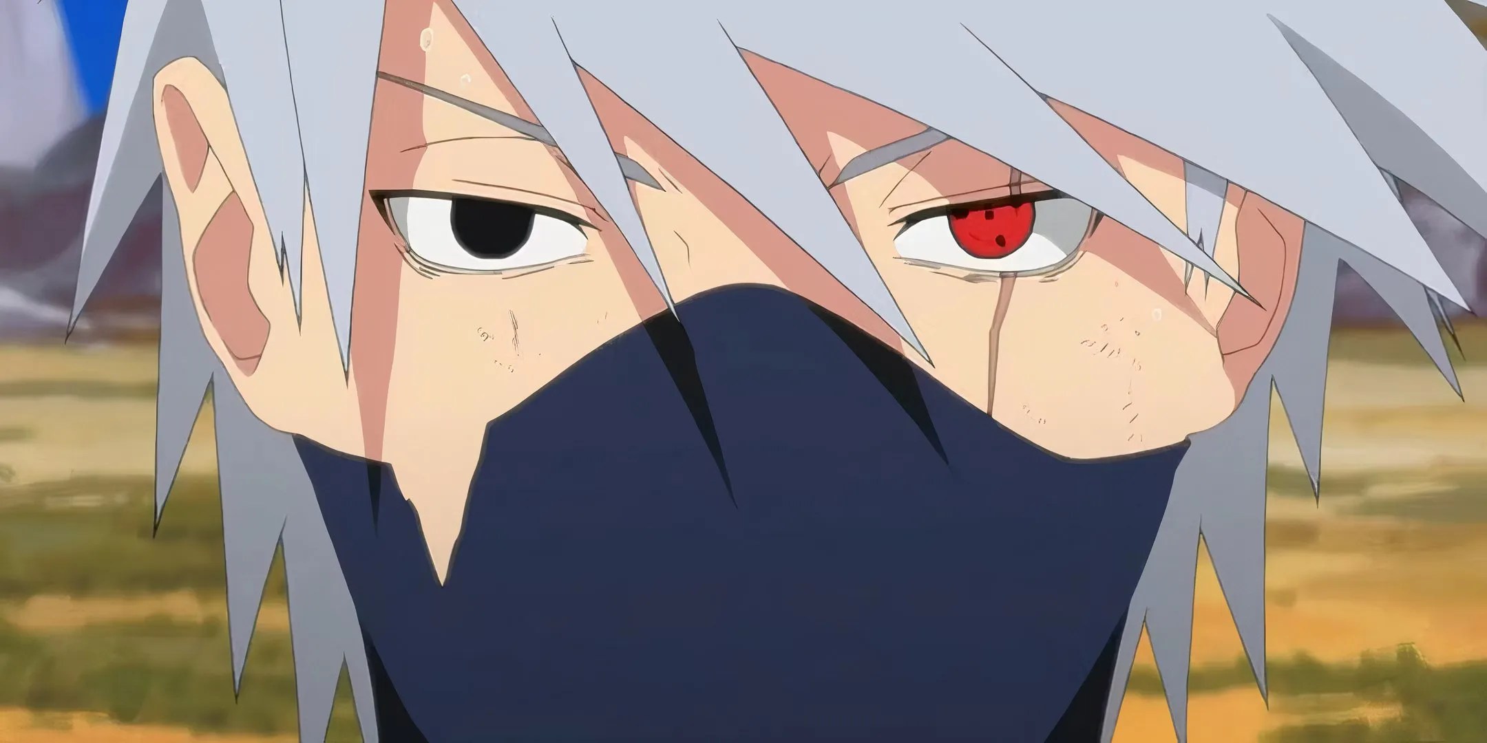 A close up of Kakashi&rsquo;s face, one eye is black while the other show&rsquo;s off his Sharingan from Naruto.