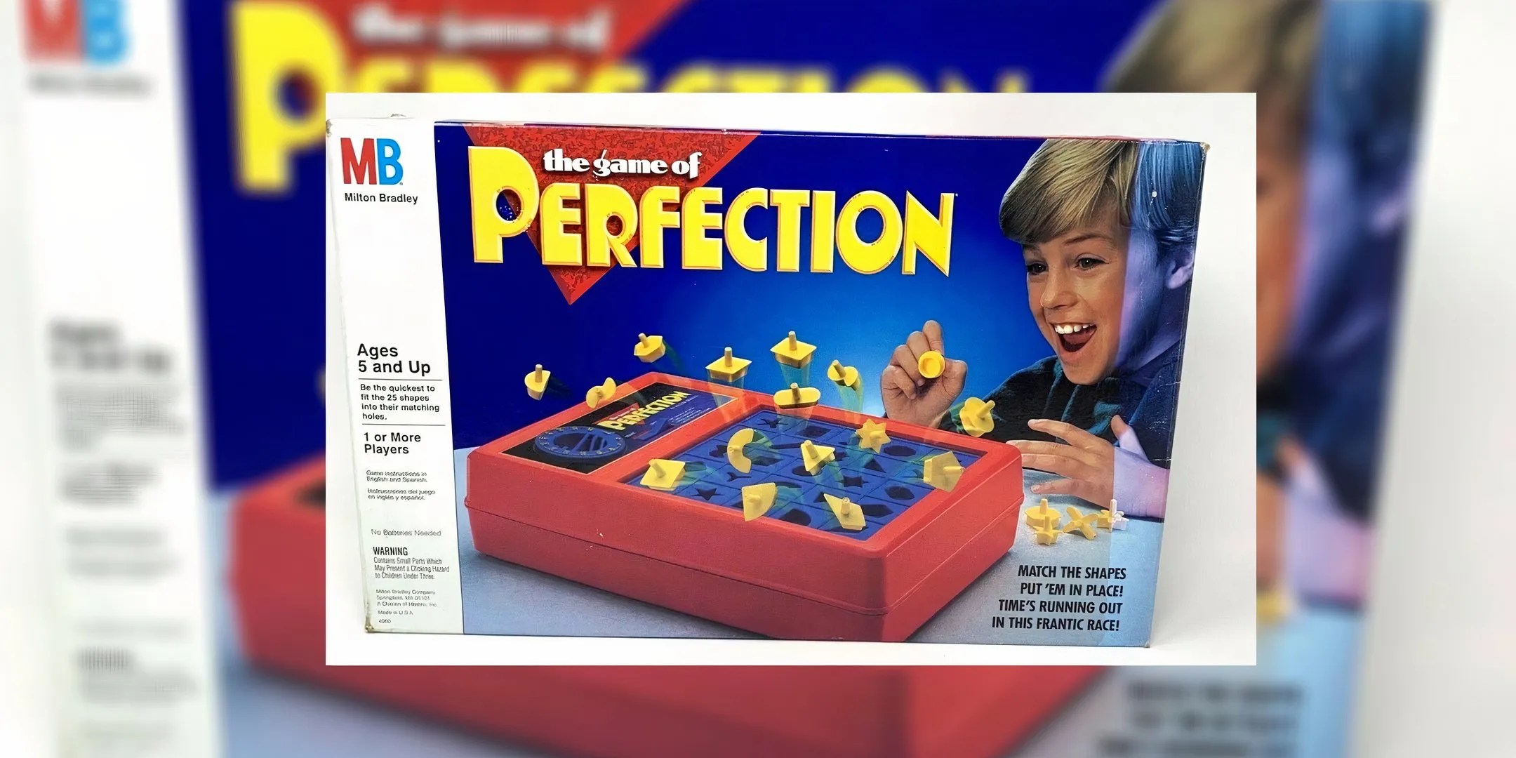 Perfection board game cover with a child smiling as game pieces pop out the game.