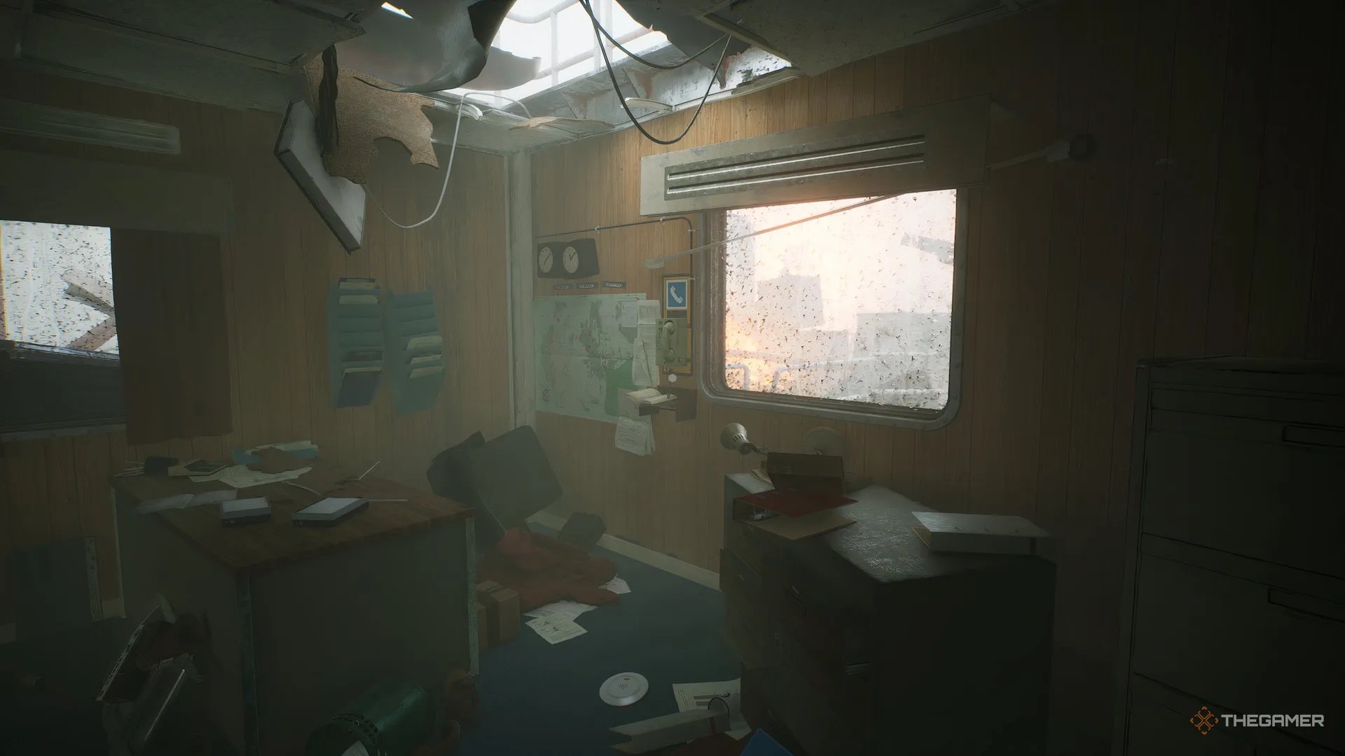 Phone on the back wall of Rennick&rsquo;s office, window on the right, map and world clocks on the left, in Still Wakes The Deep.