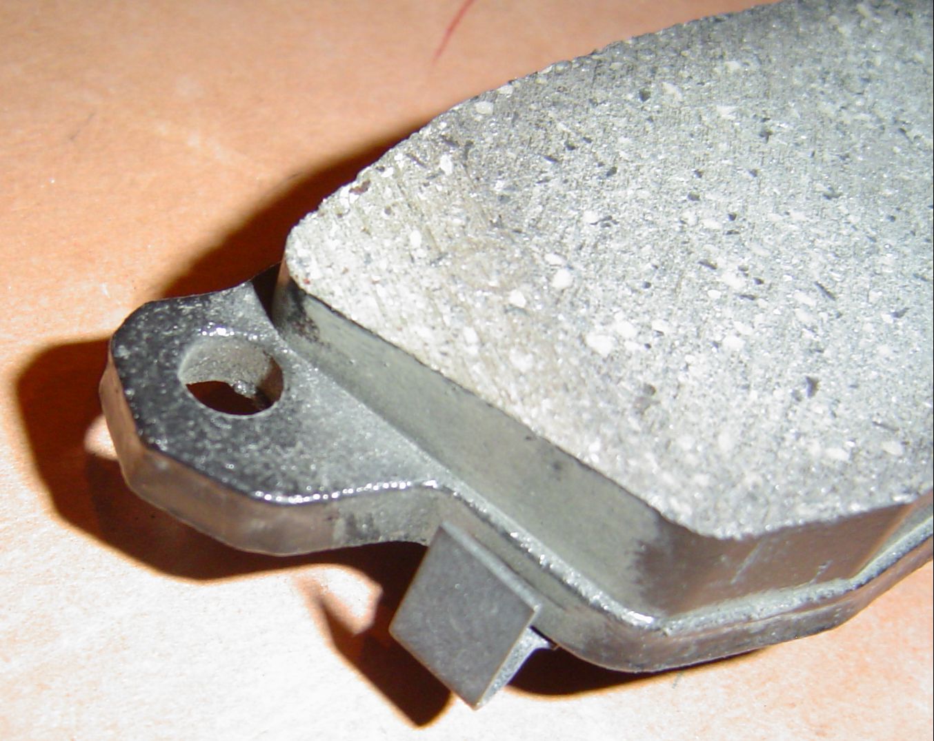 Assembly_Front Brakes_New Pads_wear indicator tab_closeup Michael