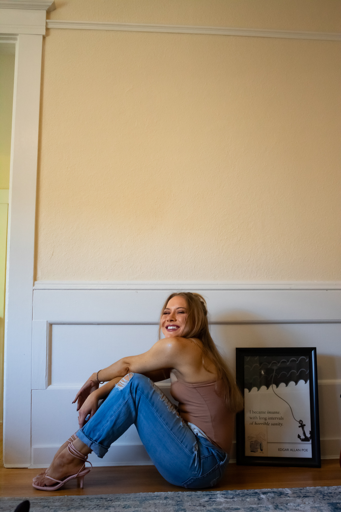 a nude bodysuit, ripped jeans, and kitten heels for a day of work at home. 